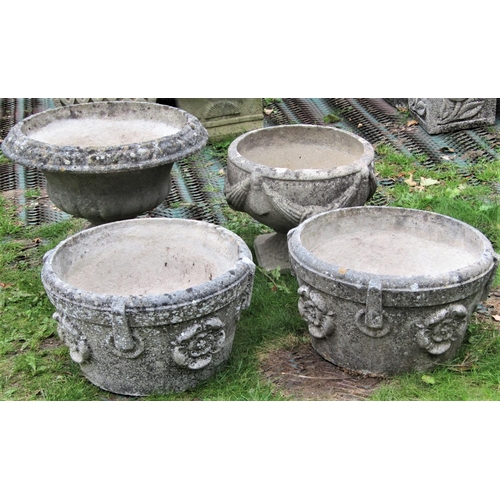 1565 - Four reclaimed garden urns, of varying design to include a pair of circular form with repeating ring... 