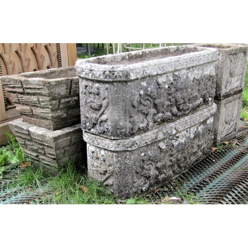 1572 - A pair of reclaimed garden planters of rectangular form with canted corners, lions mask and scrollin... 