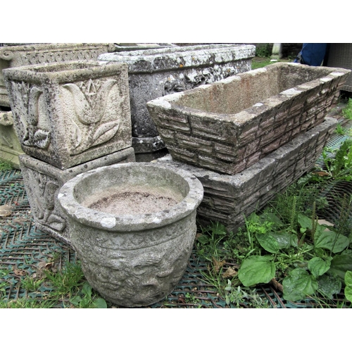 1572 - A pair of reclaimed garden planters of rectangular form with canted corners, lions mask and scrollin... 