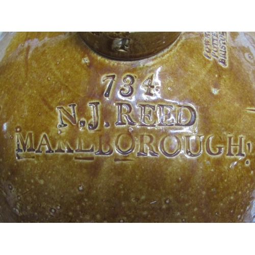1624 - A stoneware four gallon flagon with impressed number 734 and merchants mark for N J Reed, Marlboroug... 