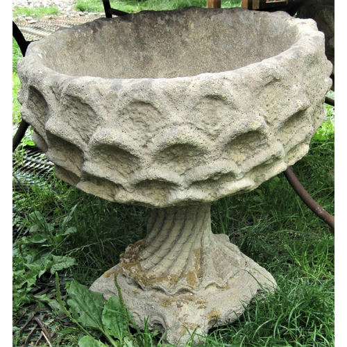 1564 - A pair of reclaimed garden urns, with circular repeating shell relief bowls, raised on wrythen shell... 