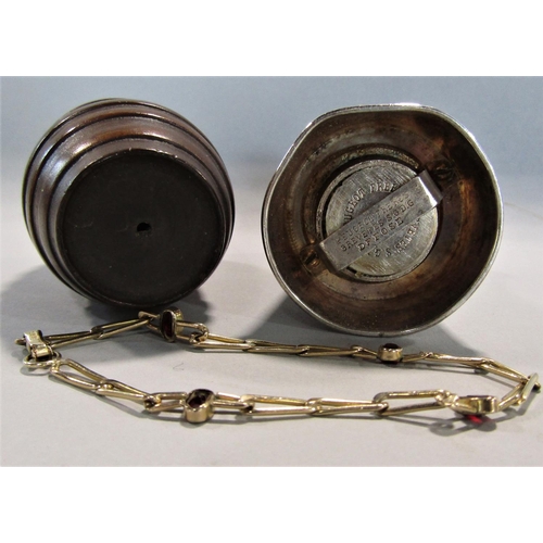 458 - A silver plated churn shaped pepper mill, a small gold plated bracelet and a treen barrel (3)