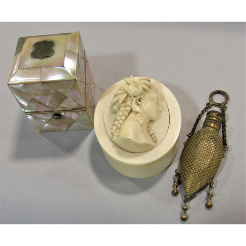 459 - A Victorian glass scent bottle enclosed within a mother of pearl panelled box a Victorian ivory box ... 