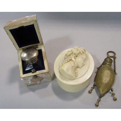 459 - A Victorian glass scent bottle enclosed within a mother of pearl panelled box a Victorian ivory box ... 