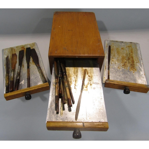 460 - A small pine tower of three drawers each holding a selection of oiling or calligraphy brushes 18cm m... 