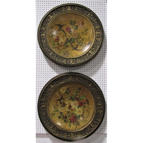 522 - A pair of enamelled japanned plaques decorated with birds amidst foliage within further classical Ad... 