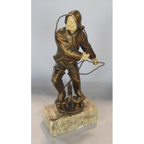 534 - Early 20th century model of a fisherman hauling a rope with carved ivory facial and hand features, r... 