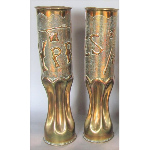 543 - A pair of first World War Trench art shells with embossed detail of Ypres