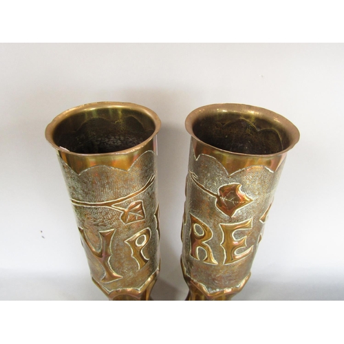 543 - A pair of first World War Trench art shells with embossed detail of Ypres