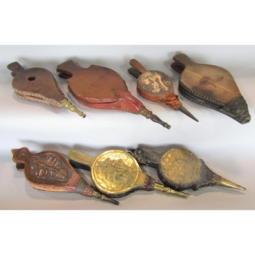 559 - Seven pairs of bellows 19th century and later, in hard wood, embossed brass, etc