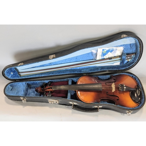 569 - A Czechoslovakian students violin - Tatra by Rosetti with case and bow, (three quarter size)