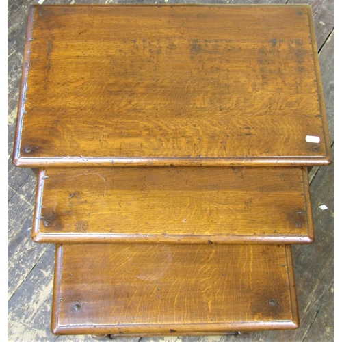 2138 - A good quality nest of three graduated occasional tables in the antique style raised on baluster sup... 