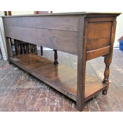 2139 - A good quality oak dresser base in the Jacobean style fitted with three frieze drawers with applied ... 