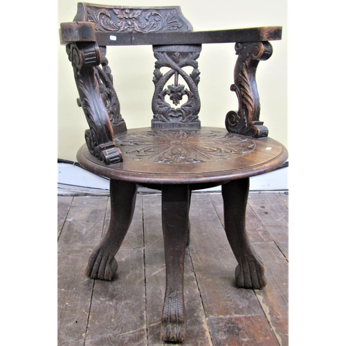 2140 - A Victorian oak office chair, the circular seat supporting a horseshoe shaped back with carved and p... 