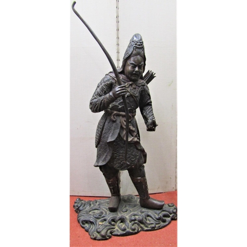 2149 - A bronze figure of a Japanese bowman holding a bow and a small bird, on his back a quiver, in tradit... 