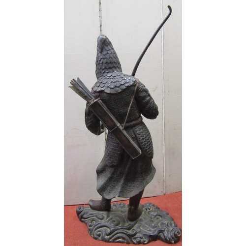 2149 - A bronze figure of a Japanese bowman holding a bow and a small bird, on his back a quiver, in tradit... 