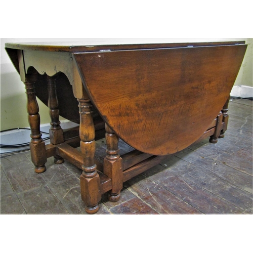 2154 - A good quality oak gateleg table with double gate action, raised on turned supports, together with e... 