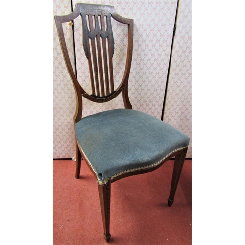 2160 - An Edwardian satinwood chair with shield shaped back and upholstered seat on square tapered legs on ... 