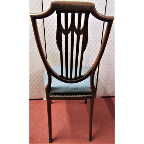 2160 - An Edwardian satinwood chair with shield shaped back and upholstered seat on square tapered legs on ... 