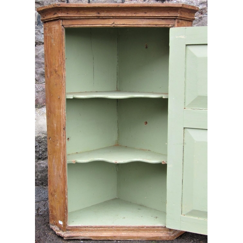 2161 - A small Georgian hanging corner cupboard in mixed woods, elm and pine, partially stripped, together ... 