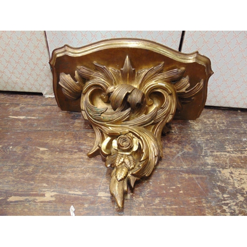 2163 - A flamboyant 19th century gilded wall bracket with scrolled and foliated detail and original gilded ... 