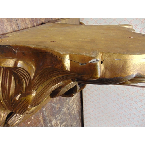 2163 - A flamboyant 19th century gilded wall bracket with scrolled and foliated detail and original gilded ... 