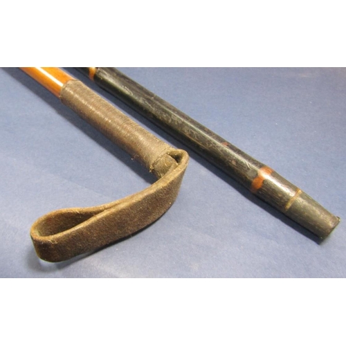 511 - Horn handled Malacca riding crop, together with a further bamboo shafted cane with tusk handle (2)