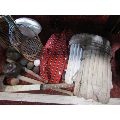 524 - A mixed sporting lot comprising cricket pads and bat, tennis rackets, a boating blazer, rugby ball, ... 