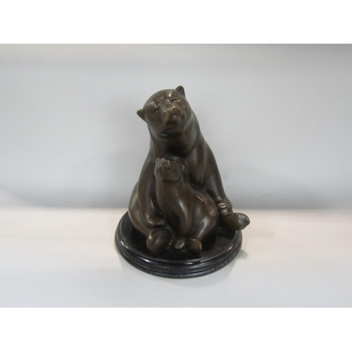 530 - Cast bronze figural study of a polar bear and cub, upon a stepped circular black marble base, Paris ... 