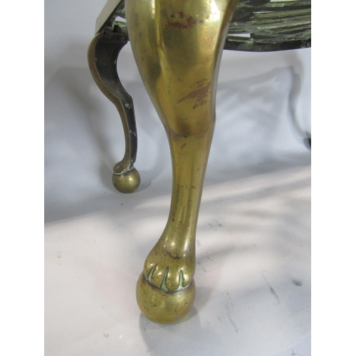 532 - Antique brass footman, with pierced scrolled top and four cabriole legs, 41cm long x 19cm high