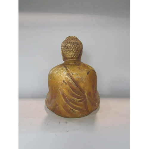 533 - A gilt metal study of a seated Buddhistic deity, 27 cm high