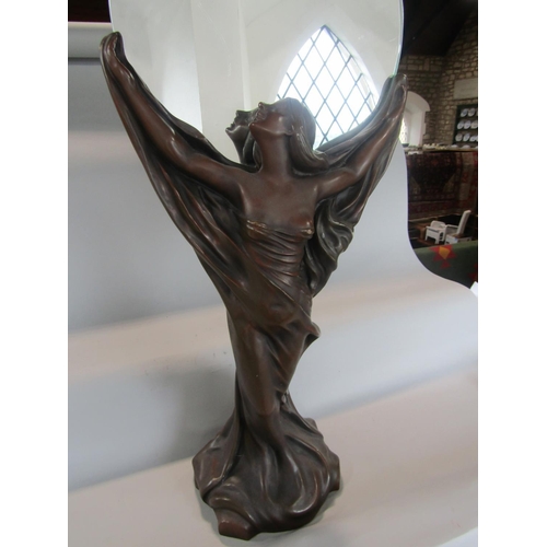 535 - Art Nouveau style figural mirror, the circular plate held aloft by a semi nude maiden, 87 cm high