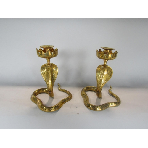 538 - Pair of Eastern brass figural candlesticks in the form of cobras, 23 cm high (2)