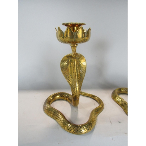 538 - Pair of Eastern brass figural candlesticks in the form of cobras, 23 cm high (2)