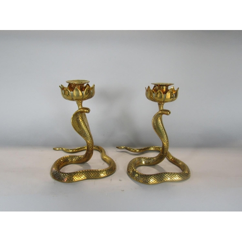 538 - Pair of Eastern brass figural candlesticks in the form of cobras, 23 cm high (2)