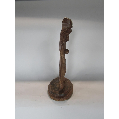 540 - A figural cast iron fire iron holder in the form of a fagan looking character, 38 cm high