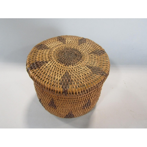 567 - Interesting native American wickerwork lidded casket of circular form, 10cm high x 13cm diameter