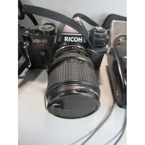 574 - Ricoh KR10 Super Camera, with Hoiya 55m Skylight lens, within a soft carry case with further Olympus... 