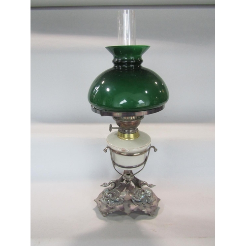 582 - A good quality late 19th century silver plated figural oil lamp, the base cast with swans, with glas... 