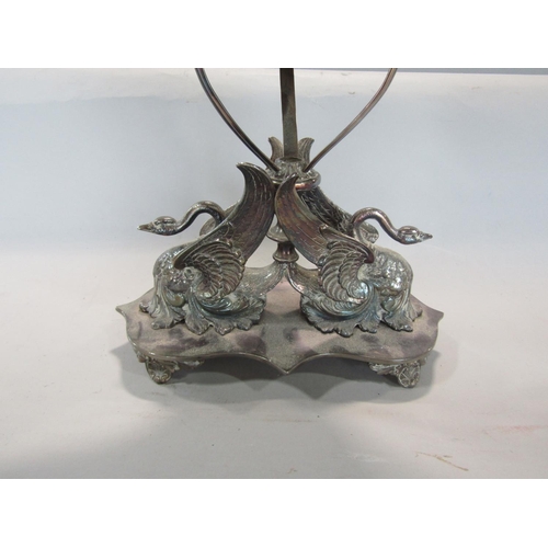 582 - A good quality late 19th century silver plated figural oil lamp, the base cast with swans, with glas... 