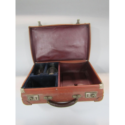 591 - A leather cased travelling communion set, fitted with two silver plated lidded bottles