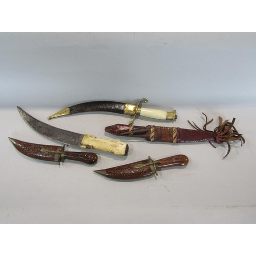 596 - A collection of eastern daggers (5)