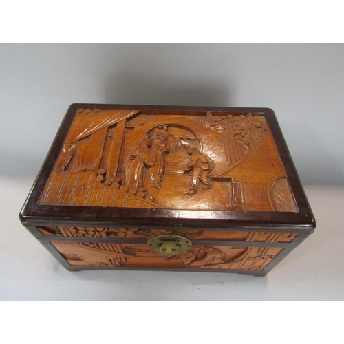 601 - Chinese carved camphor wood table top casket, decorated with figures in an interior and exterior set... 