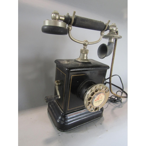 602 - Vintage Kirstin Kirks telephone, with windup handle and japanned steel frame, 32cm high