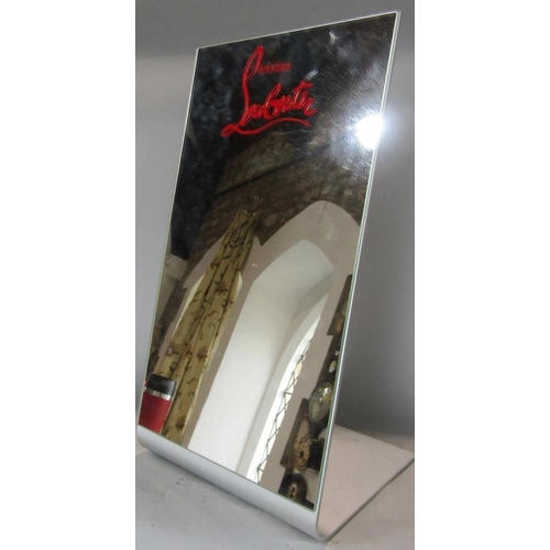 603 - A Christian Louboutin shoe mirror of angled form, 39cm high