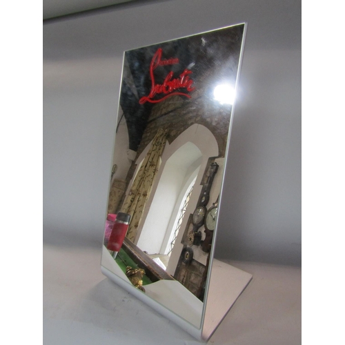 603 - A Christian Louboutin shoe mirror of angled form, 39cm high