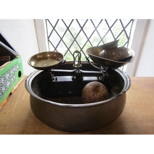 606 - A mixed lot to include an antique cannon ball, a bronze pedestal dish, a pair of weighing scales and... 