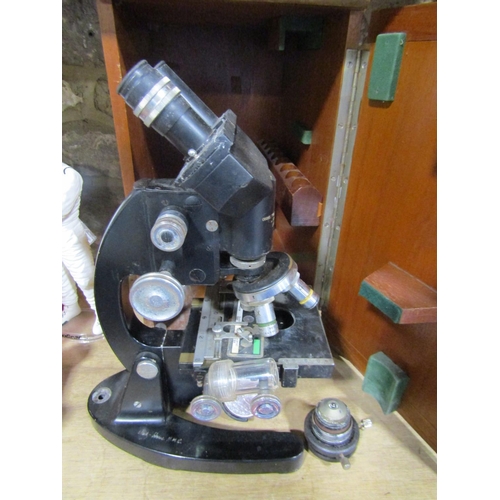 614 - A Vintage Cooke Troughton & Simms black lacquered binocular microscope within a wooden case