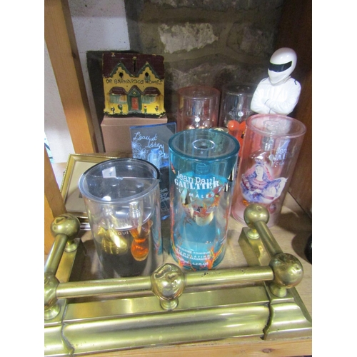 615 - A collection of vintage Jean Paul Gaultier perfume in original boxes, a small brass curb, some minia... 