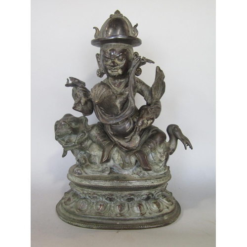 539 - Good antique Eastern brass study of two Buddhistic deities upon a dog of fo, the gentleman character... 